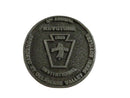 Metallic badge with 'Keystone' branding on a white background