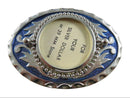 Decorative silver and blue oval dollar coin belt buckle with text on a white background
