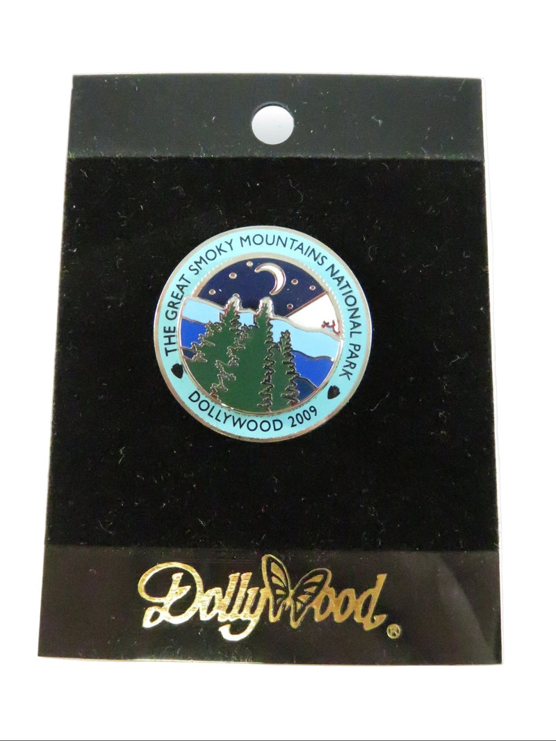 Pin with a design of mountains and trees on a black card with 'Bullseye' branding.
