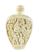 Decorative snuff bottle with intricate designs on a white background