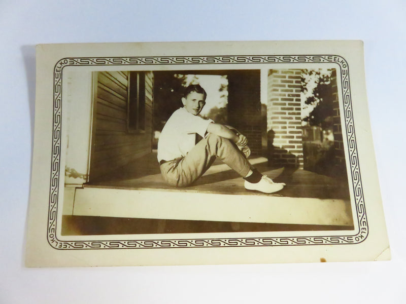 c1936 Elko Border Photograph of Young Man Sitting on Porch 5" x 3 1/4