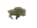 Pewter buffalo figurine on a white background