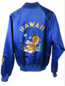 Blue sweatshirt with tiger design and 'Hawaii' text on a wooden background