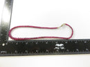 Close view of graduated pink disc beads