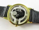 Opened case showing quartz movement and battery