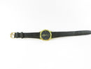 Gold-tone case and black textured strap