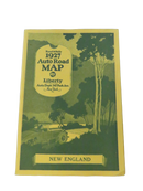 Front cover of the 1927 Rand McNally New England Auto Road Map with Liberty Auto Dept. branding and an illustrated rural road scene.