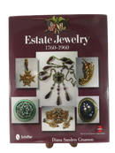 Front jacket cover of Estate Jewelry 1760-1960 by Diana Sanders Cinamon, Revised and Expanded 2nd Edition, with photographs of jewelry pieces.