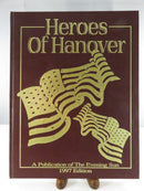 Front cover of Heroes of Hanover, a maroon 1997 Evening Sun hardcover with gold title and crossed American flags illustration.