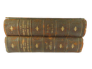 Spines of the two leather-bound volumes of The Youths' History of the United States, labeled Ellis Vol. I-II and Ellis Vol. III-IV, with gilt decoration and heavy wear.