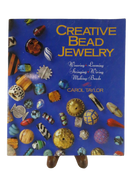 Front cover of Creative Bead Jewelry by Carol Taylor, with photographed beads and the subtitle Weaving, Looming, Stringing, Wiring, Making Beads.