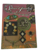 Front cover of Collectible Silver Jewelry Identification and Value Guide by Fred Rezazadeh, with photographs of silver jewelry.