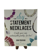 Front cover of DIY Statement Necklaces: Create Your Own Customizable Jewelry—for Less! by Erin Pruckno, with necklace photographs.