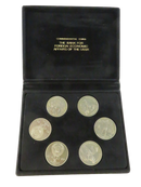 Open black velvet presentation case holding six USSR 1991 Olympic commemorative 1 Ruble coins
