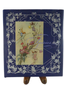Front of the blue Fairies dust jacket, with butterfly-and-vine border and an illustration of fairies among poppies.