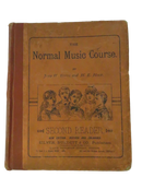 Front cover of The Normal Music Course Second Reader by John W. Tufts and H. E. Holt, with a printed illustration of five young singers.