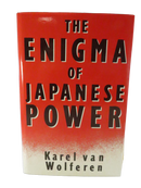 Front dust jacket of The Enigma of Japanese Power by Karel van Wolferen, with bold black title lettering on a red and cream ground.