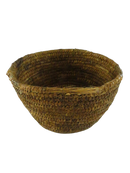 Front three-quarter view of the tapered hand-woven natural fiber basket bowl against a black background.
