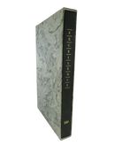 Side view of Excellence: An American Treasury showing the black gilt-lettered spine and marbled boards.