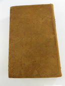 Spine of the leather hardcover, with a worn dark title label reading Comstock Natural Philosophy.
