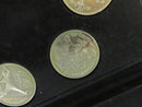 Close view of cycling-themed Barcelona 1992 commemorative coin in velvet case