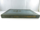 Low side view of the green cloth yearbook spine with gilt Wake Forest College titling.