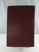 Plain burgundy cloth rear cover of The Conqueror.