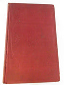Red cloth back cover of one volume with blind-stamped border and central ornamentation.