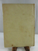 Plain pale cloth back cover of Opals From Holmes with visible staining and wear.