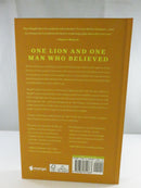 Rear cover of The Pride of a Lion with synopsis headed “One Lion and One Man Who Believed,” Mango logo, and barcode.
