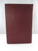 Plain maroon cloth rear board of the hardcover.