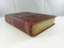 Angled view of the spine, fore edge, and worn text block of The Conqueror.