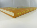 Low angled view of the brown hardcover spine and lower page block of The Pride of a Lion.