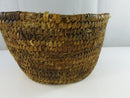 Close side view of the basket showing surface losses and loose fibers near the rim.