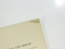 Close view of a dog-eared upper corner on an interior page of the pamphlet.