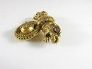 Victorian Archaeological Revival Double Griffin Brooch in Gold with Ruby Eyes