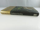 Side view of the hardcover in its dust jacket, showing the spine titled Slow Waltz in Cedar Bend and the Warner Books logo.