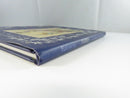 Low side view of the Fairies hardcover in its dust jacket, showing the spine lettering and worn lower jacket edge.