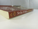 Low angled view of the spine reading Strike It Rich with Pocket Change and 4th Edition, with worn page edges.