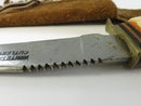 Close view of sawback teeth and brass crossguard on Whitetail Cutlery blade
