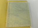 Partially folded pale green road map shown inside the opened yellow cardstock sleeve.