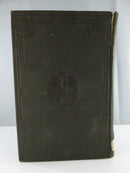 Rear embossed dark brown cloth board with surface wear and damage along the spine edge.