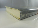 Lower edge and spine view of hardcover with dust jacket wear