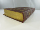 Angled view of The Conqueror showing the gilt-lettered spine and browned page edges.