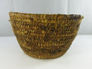 Side view of the natural fiber coil basket with tapered walls and wrapped rim.