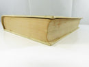 Fore-edge and lower page block of the hardcover, showing age-toned and soiled page edges