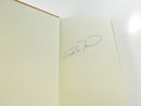 Front free endpaper bearing Ron Magill's handwritten signature.