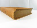 Front and rear pastedowns with exposed cloth webbing at the split inner hinge.