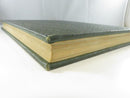 Open yearbook showing the pale green front and rear endpapers.
