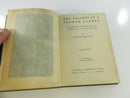 Open book showing a photographic frontispiece beneath its tissue guard and the title page